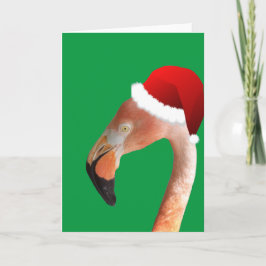 Rosa Flamingo in roter Cartoon Weihnachtsmannmütze Feiertagskarte