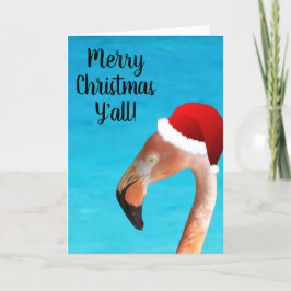 Rosa Flamingo in roter Cartoon Weihnachtsmannmütze Feiertagskarte