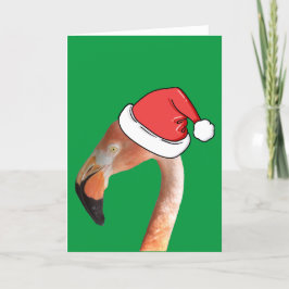 Rosa Flamingo in roter Cartoon Weihnachtsmannmütze Feiertagskarte