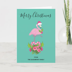 Rosa Flamingo in Santa-Hut mit Candy-Cane-Blumenst Feiertagskarte