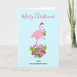 Rosa Flamingo in Santa-Hut mit Candy-Cane-Blumenst Feiertagskarte