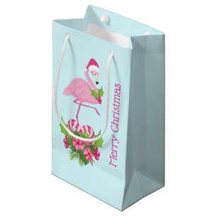 Rosa Flamingo in Weihnachtsmannmütze mit Candy Can Kleine Geschenktüte