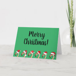 Rosa Flamingos in roten Weihnachtsmannmützen Weihn Feiertagskarte