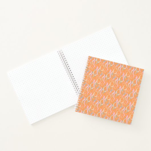 Rosa Gelbe Aqua-Blasen im Orange Bullet Journal Notizblock (Innenseite)
