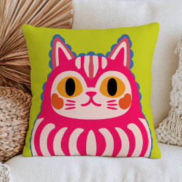 Rosa japanische Neko-Katze Daruma-Puppe auf hellgr Kissen