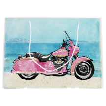 Rosa Motorrad am Strand