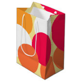 Rosa, orange und gelbe Polka-Punkte Mittlere Geschenktüte (Vorderseite Schrägansicht)