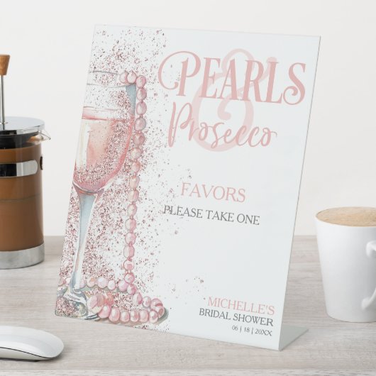 Rosa Perlen und Prosecco-Favoriten Sockelschild (In Situ)