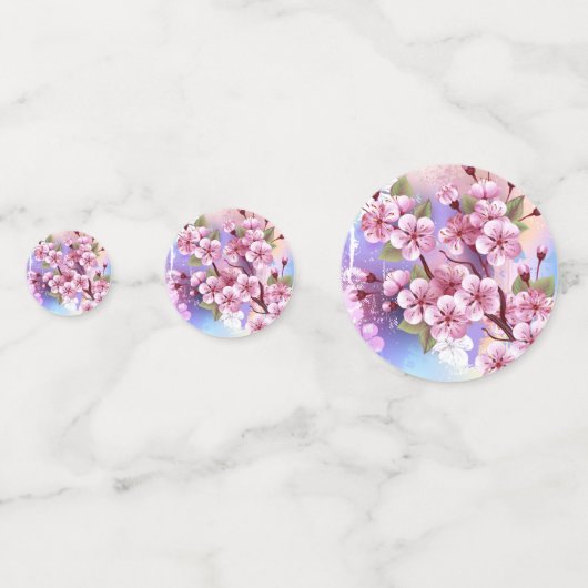 Rosa Sakura auf dem Hintergrund der Malerei Konfetti (Rückseiten)