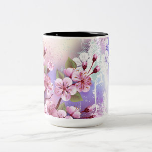Rosa Sakura auf dem Hintergrund der Malerei Zweifarbige Tasse