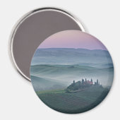 Rosa Sonnenaufgang über dem runden Magneten der To Magnet (Vorderseite/Rückseite)