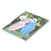 Rosa und blaue Budgien gegen Engel Trumpets Notizblock (Rotiert)