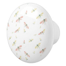 Rosa und gelbe Libellen auf der weißen Keramik