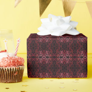 Rosa und rote Punkte und Schlängelchen-Muster auf Geschenkpapier