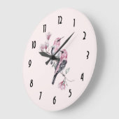 Rosa und schwarze Vögel auf einem Baumzweig Große Wanduhr (Winkel)