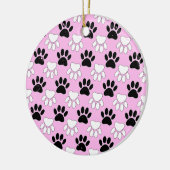 Rosa Untergrund: erschütterte schwarz-weiße Paws Keramikornament (Links)
