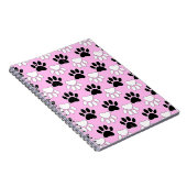 Rosa Untergrund: erschütterte schwarz-weiße Paws Notizblock (Rechte Seite)