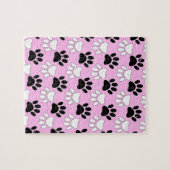 Rosa Untergrund: erschütterte schwarz-weiße Paws Puzzle (Horizontal)