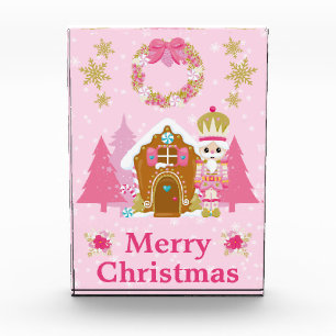 Rosa Weihnachtsnussknacker und Lebkuchenhäuschen Fotoblock