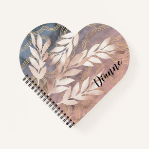 Rose-Gold-Blatt-Sprays auf abstraktem Hintergrund Notizblock