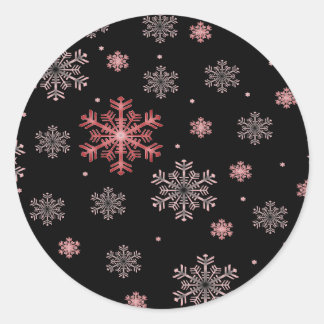 Rot/Rosa Schneeflocken auf Schwarz - Winterkleber Runder Aufkleber