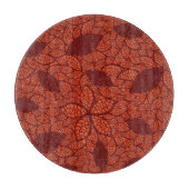 Rot verlässt Muster auf Orange Schneidebrett (Vorderseite)