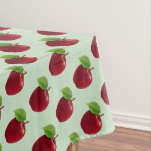 Rote Äpfel auf Hellgrün Tischdecke