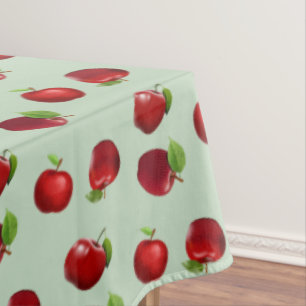 Rote Äpfel auf hellgrünem Tablettlappen Tischdecke