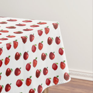 Rote Äpfel auf Weiß Tischdecke