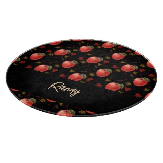 Rote Äpfel und Blätter auf schwarz Schneidebrett (Ecke)