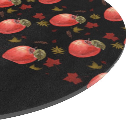 Rote Äpfel und Blätter auf schwarz Schneidebrett (Ecke)