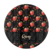 Rote Äpfel und Blätter auf schwarz Schneidebrett (Vorderseite)