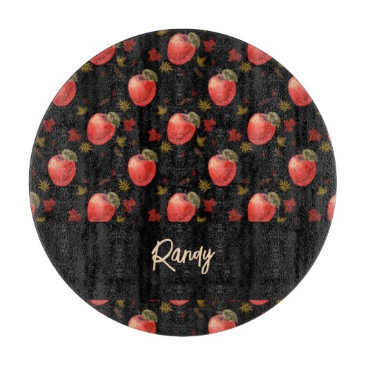 Rote Äpfel und Blätter auf schwarz Schneidebrett (Vorderseite)