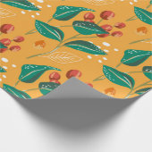 Rote Beere und grüne Blätter auf gelbem Muster Geschenkpapier (Ecke)