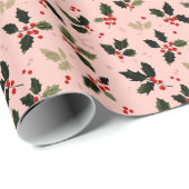 Rote Beeren und Stechpalme auf Rosa Geschenkpapier (Rolleneckpunkt)