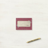 Rote Burgunder-Blumen mit geaufnommenem Aufkleber Post-it Klebezettel (Auf Schreibtisch)