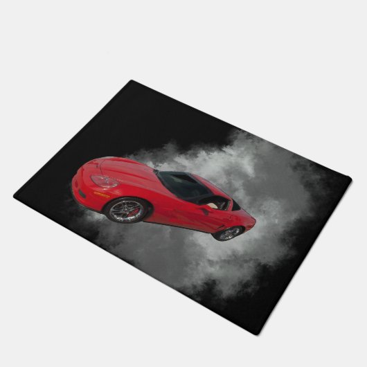 Rote Corvette mit grauem, rauchabnehmbarem Hinterg Fußmatte (Schrägansicht)