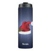 Rote festliche Weihnachtsmannmütze auf blau mit In Thermosbecher (Vorderseite)