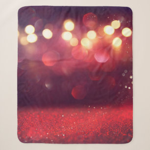 Rote Glitter-Vintage-Lichter Hintergrund. unscharf Sherpadecke