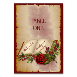 Rote, glühende Rose auf den Seiten der Gold-Farbbi Tischnummer