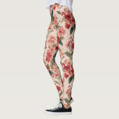 Rote Hibiskus-Blumen auf Rosa Leggings (Links)