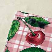 Rote Kirschen auf rosa Gingham Strandtuch (Beispiel)