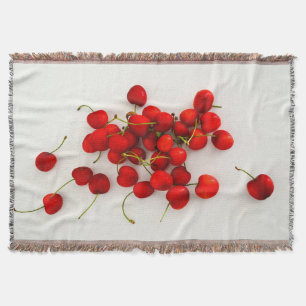 Rote Kirschen auf weißer Seite Decke