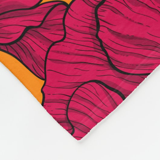 Rote Pfeffer und blaue Kornblumen auf Orange Fleecedecke (Ecke)