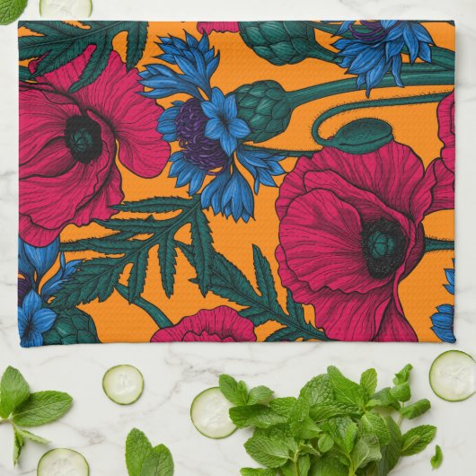 Rote Pfeffer und blaue Kornblumen auf Orange Geschirrtuch (Gefaltet)