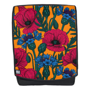 Rote Pfeffer und blaue Kornblumen auf Orange Rucksack