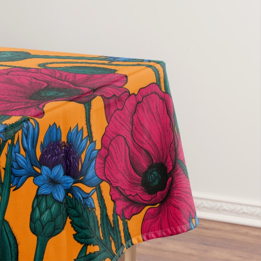 Rote Pfeffer und blaue Kornblumen auf Orange Tischdecke (Beispiel)