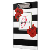 Rote Pflaumen auf schwarz-weiß gestreiftem Hinterg Klemmbrett (Links)