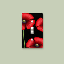 Rote Pflöten auf der schwarzen Light Switch-Abdeck
