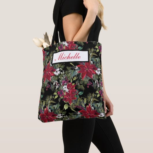 Rote Poinsettien und weiße Blume auf Schwarz Tasche (Von Nahem)